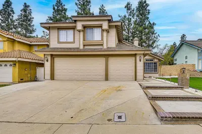 a house with a garage in front of it at 2 Mi to Victoria Gardens Rancho Cucamonga Haven in Rancho Cucamonga