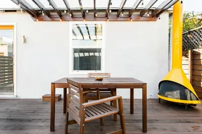 a patio with a table and a fire place at Perfect Venice Beach Vacation Home for Couples and Families in Los Angeles