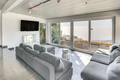 a large living room with couches and a tv at 3 Mi to Beach Home with Pool and Spa in Malibu! in Malibu