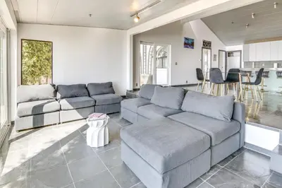 a living room with two couches and a table at 3 Mi to Beach Home with Pool and Spa in Malibu! in Malibu