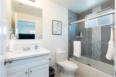 a bathroom with a toilet and a sink and a shower at La Veranda View Hideaway in Los Angeles