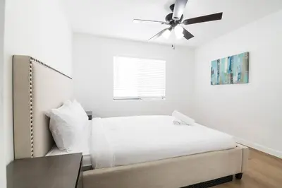 a bedroom with a bed and a ceiling fan at 2BR Plus Bonus Room and Pool Access Near Universal Studios in Los Angeles