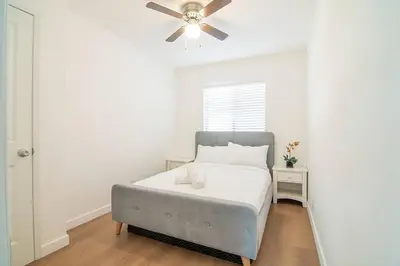 a bedroom with a bed and a ceiling fan at 2BR Plus Bonus Room and Pool Access Near Universal Studios in Los Angeles
