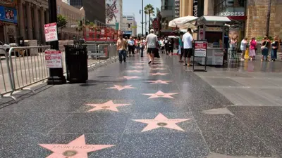 a sidewalk with stars painted on the ground at 3 bedroom top story apartment near Pico blvd in Los Angeles
