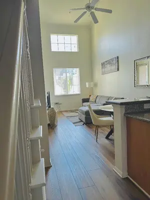 a living room with a couch and a table at Loft Style,2 Beds ,Flexible self check in,Pool in Marina del Rey