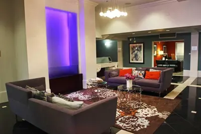 a living room with two couches and a table at Cozy Apartment Homes On Wilshire Corridor in Los Angeles