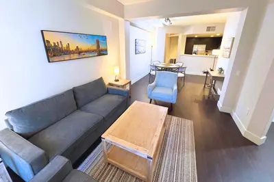 a living room with a couch and a table at Cozy Apartment Homes On Wilshire Corridor in Los Angeles