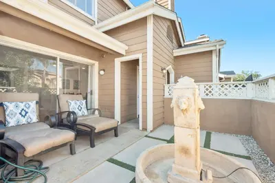 a patio with a fountain in front of a house at 5bed 3bath Private gated community home 7miles to Downtown La close to Disney in Commerce
