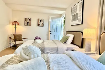 a living room with two beds and a couch at Jies choice Contemporary Elegance in Altadena in Altadena