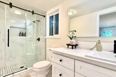 a bathroom with a shower and a toilet and a sink at Jies choice Contemporary Elegance in Altadena in Altadena