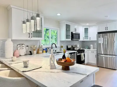 a kitchen with a counter with a bowl of fruit on it at Jies choice- Modern Luxe in Altadena in Altadena
