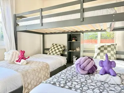 a bedroom with two bunk beds with stuffed animals on the beds at Jies choice- Modern Luxe in Altadena in Altadena