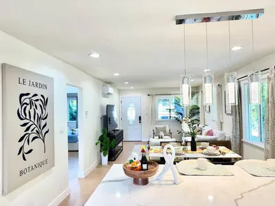 a living room with a table and a couch at Jies choice- Modern Luxe in Altadena in Altadena