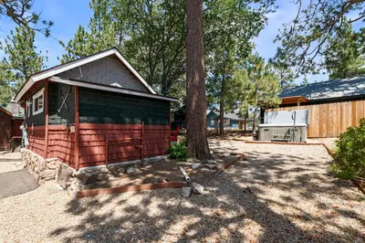 a small house with a tree in a yard at Little Lux - Hot Tub, Walk to Village & Lake in Big Bear Lake