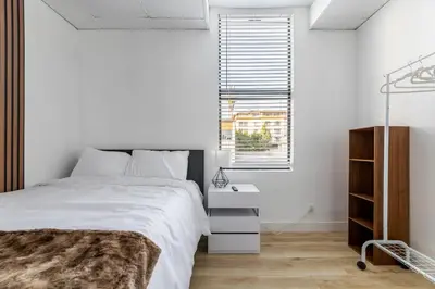 a bedroom with a white bed and a window at Walking distance to Caltech convention Center Pasadena Landmark room in Pasadena