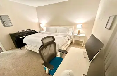 a bedroom with a bed and a desk with a chair at Cozy Gem Near Old Town Pasadena in Pasadena