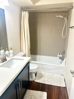 a bathroom with a sink and a toilet and a tub at Cozy Gem Near Old Town Pasadena in Pasadena