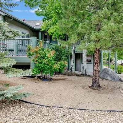 a house with two trees in front of it at Castle Glen Gem #2220 in Big Bear Lake