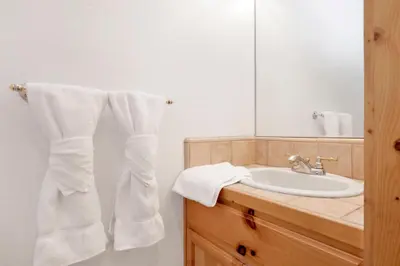 a bathroom with a sink and a mirror at Lookout Lodge #2128 in Big Bear City