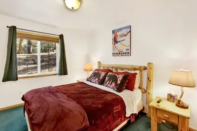 a bedroom with a bed and a window at Lookout Lodge #2128 in Big Bear City