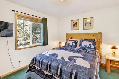 a bedroom with a bed and a window at Lookout Lodge #2128 in Big Bear City