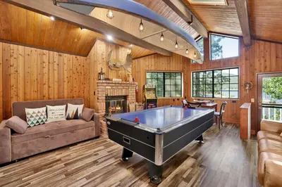 a living room with a pool table in it at Serenity Cove Lake House #2472 by Big Bear Vacations in Big Bear Lake
