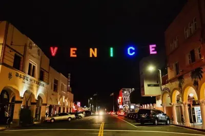 a neon sign that says verizon on a city street at night at Beautiful Getaway Near Venice in Los Angeles