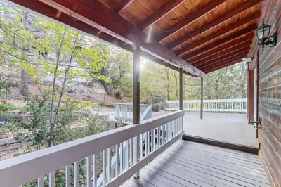 an empty porch of a house with a wooden roof at Cloud Nine in Lake Arrowhead