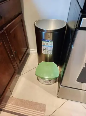 a trash can in a kitchen with a green lid at Spacious 1 Bed ADU in Encino, Home Away from Home in Los Angeles