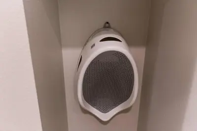 a white speaker hanging from a wall in a room at 3 Miles to Disney Heated Pool CnvntnCtr Jacuzzi in Fullerton