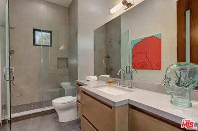 a bathroom with a toilet and a sink and a shower at Sycamore Ave in Los Angeles