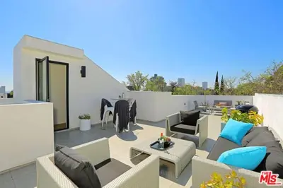 a patio with couches and chairs and a table at Sycamore Ave in Los Angeles