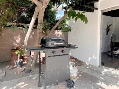 a grill with a toaster sitting on top of it at The Culver Retreat Family Oasis w Office Backyard in Los Angeles