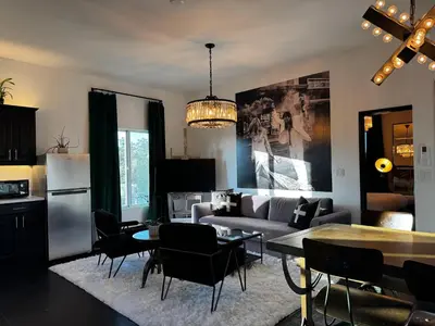 a living room with a couch and a table at The Loft at Butler in Los Angeles