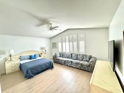 a living room with a bed and a couch at Entire Fully Furnished Home in Camarillo California. 10 Mins from the beach in Camarillo