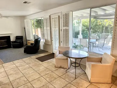 a living room with a table and chairs at Entire Fully Furnished Home in Camarillo California. 10 Mins from the beach in Camarillo
