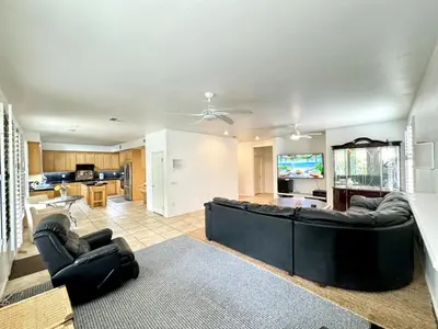 a living room with a couch and a kitchen at Entire Fully Furnished Home in Camarillo California. 10 Mins from the beach in Camarillo