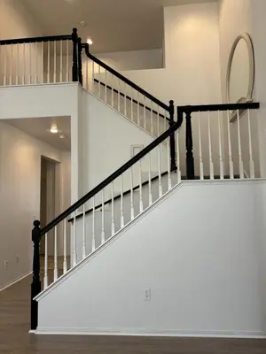 a staircase in a house with white walls at Entire Fully Furnished Home in Camarillo California. 10 Mins from the beach in Camarillo