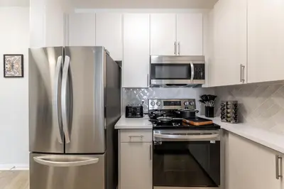 a kitchen with a stainless steel refrigerator and microwave at Cozy 2BD Retreat in MarinaDelRey!Free Parking&Pool in Los Angeles