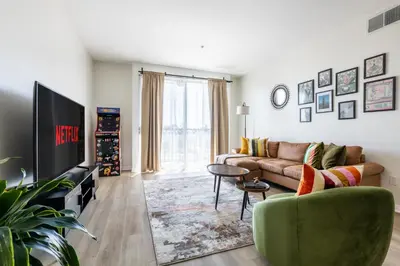 a living room with a couch and a tv at Cozy 2BD Retreat in MarinaDelRey!Free Parking&Pool in Los Angeles