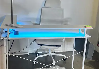 a blue desk with a computer on top of it at 1 br spacious in Hollywood in Los Angeles