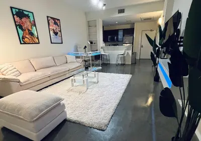 a living room with a white couch and a table at 1 br spacious in Hollywood in Los Angeles