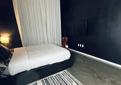 a small bedroom with a bed and a television at 1 br spacious in Hollywood in Los Angeles