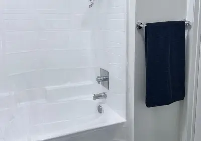 a bathroom with a shower with a white tub at 1 br spacious in Hollywood in Los Angeles