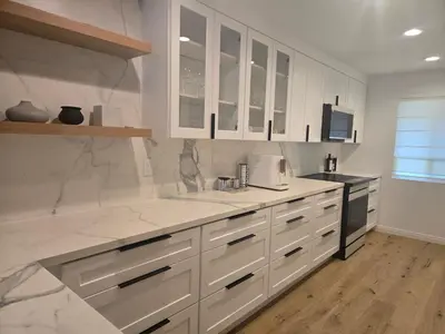 a kitchen with white marble counter tops and appliances at NEW 2BD Majestic Gateway in Glendale in Glendale