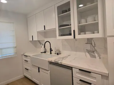 a kitchen with white cabinets and a sink at NEW 2BD Majestic Gateway in Glendale in Glendale