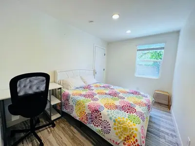 a bedroom with a bed and a desk and a chair at Huge Family House Vacation Villa VIEW Pool King Bedroom in Walnut