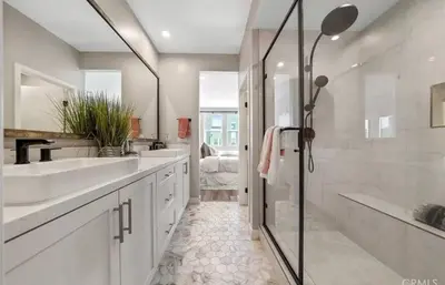 a bathroom with two sinks and a shower and a tub at 1311WCara in Anaheim