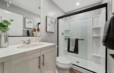 a bathroom with a shower and a toilet and a sink at 1311WCara in Anaheim