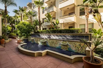 a courtyard with a fountain in front of a building at Cozy Large 1 Bedroom Condo by UCLA in Los Angeles